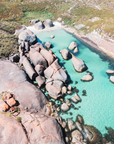 Greens Pool, Denmark showing granite boulders with clear shallow coastal water and pale sand along the shoreline