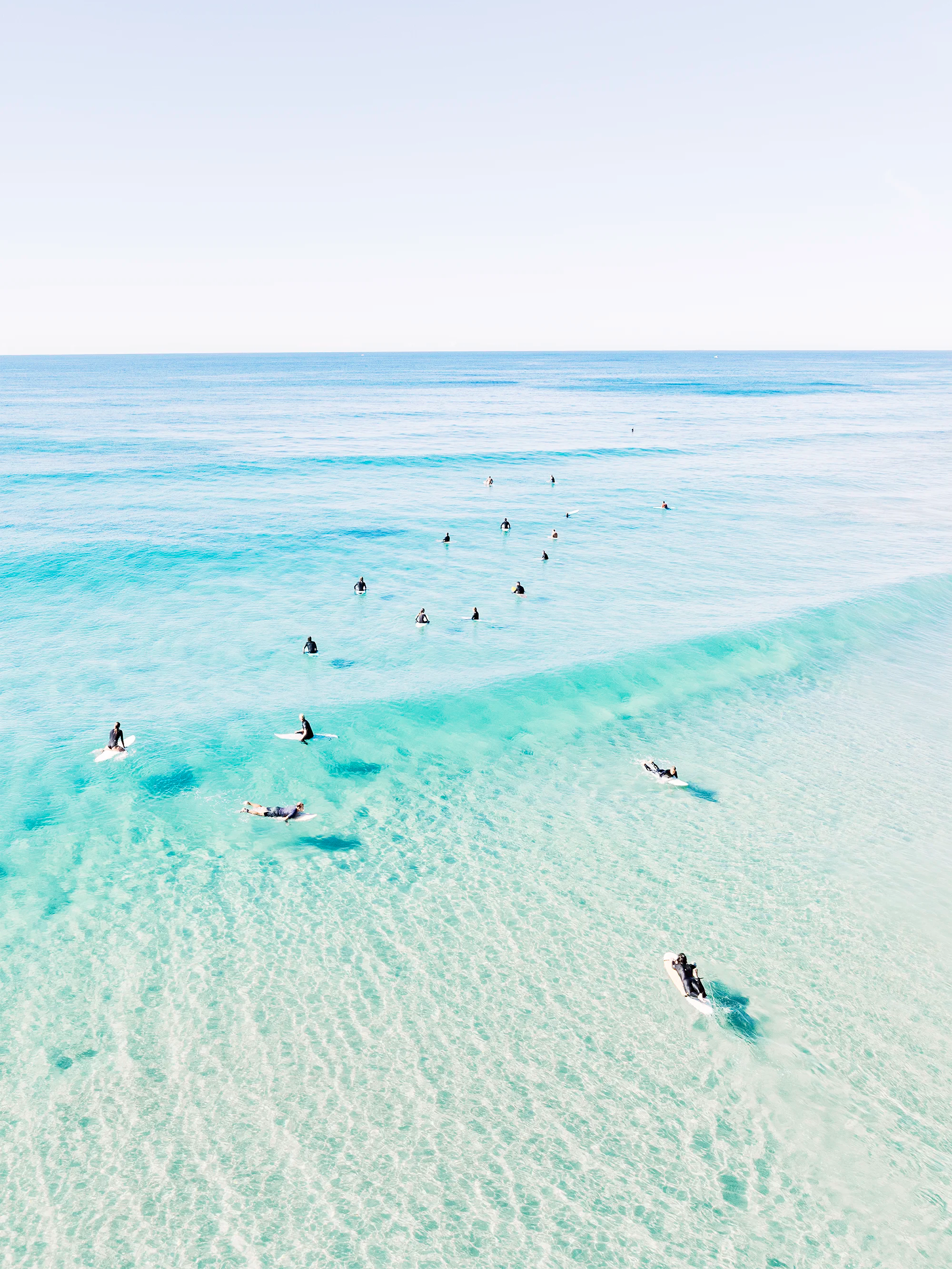 Aerial view of Second Bay, Coolum with a clear water break forming over shallow sand and visible seabed beneath