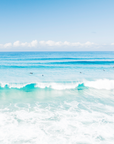 Blue skies over Suffolk Park Beach, Byron Bay with gentle waves and soft light captured in a fine art coastal print.