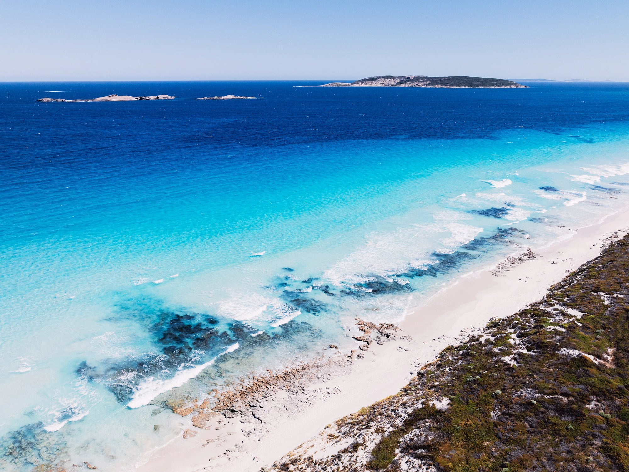 Aerial view of Twilight Beach, Esperance with Granite Islands and soft blue coastline captured as coastal wall art.