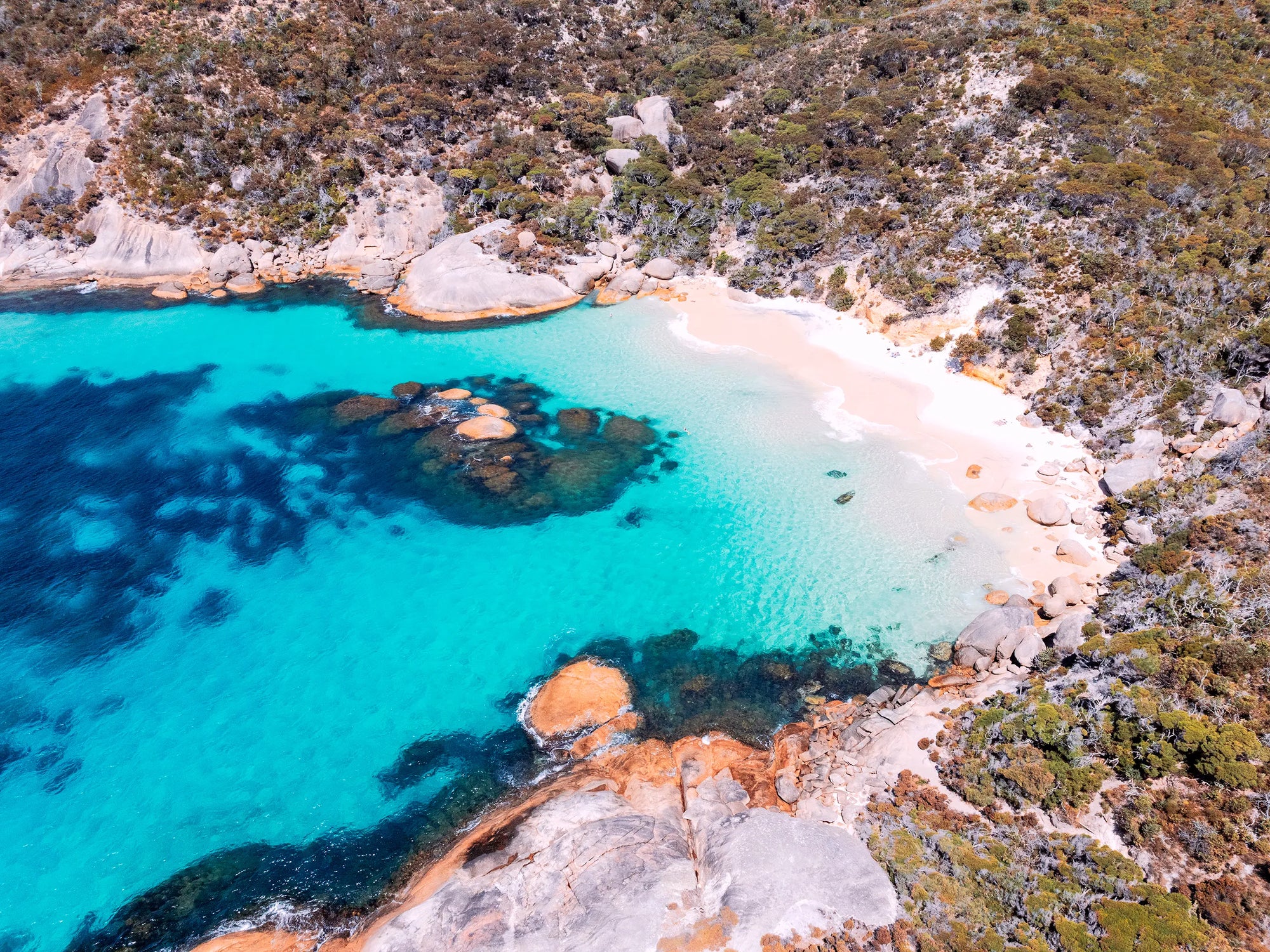 A secluded coastal cove at Waterfall Beach, Albany captured with soft light and natural tones.